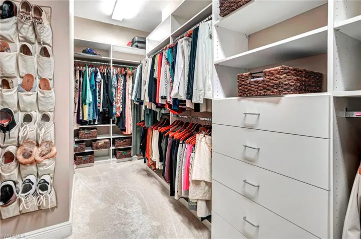 Spacious Owner's Closet with Custom Shelves