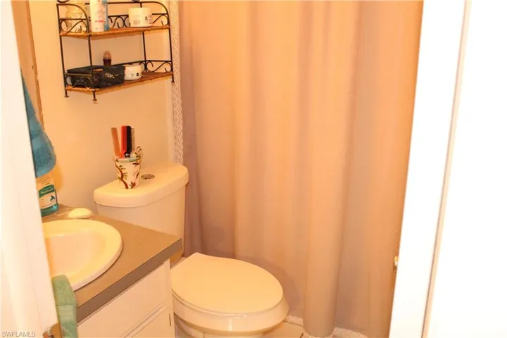 Bathroom with vanity and a shower with shower curtain