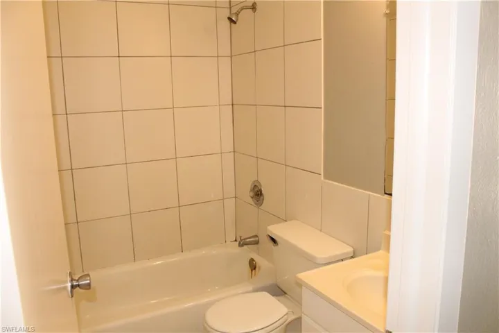 Full bathroom featuring shower / tub combination and vanity