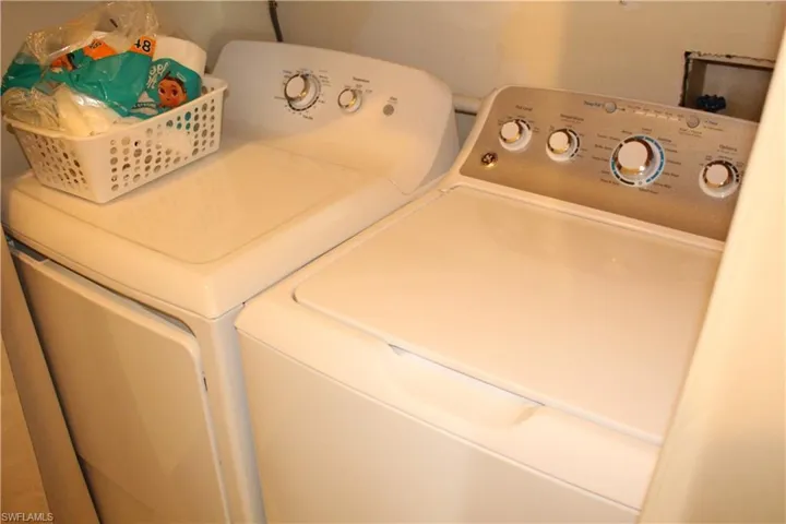 Laundry area featuring independent washer and dryer