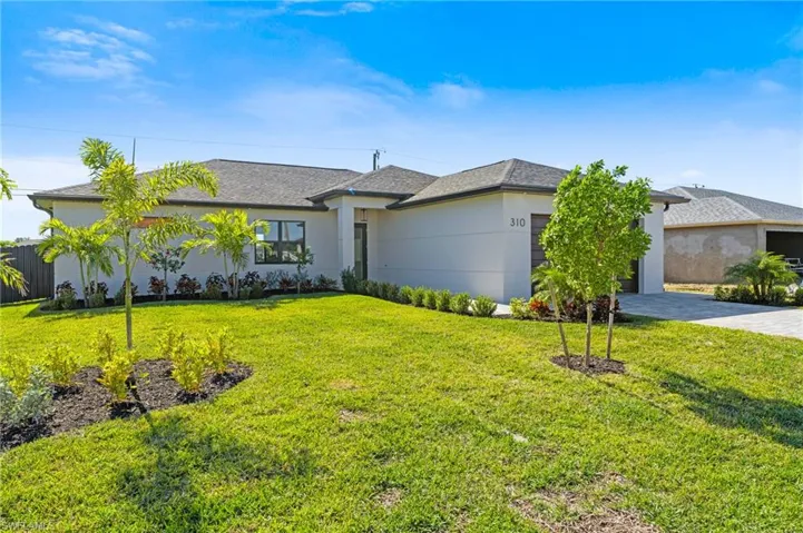 Single story home featuring a front yard