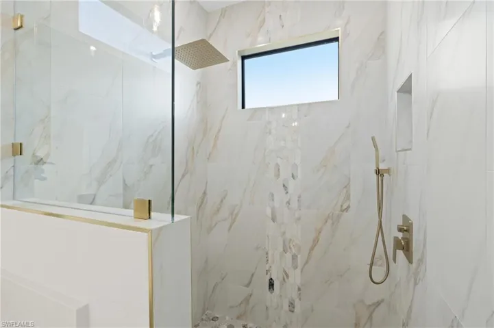 Bathroom featuring tiled shower