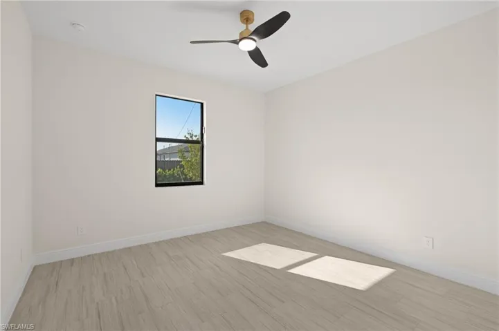 Unfurnished room featuring light Italian Tile floors and ceiling fan