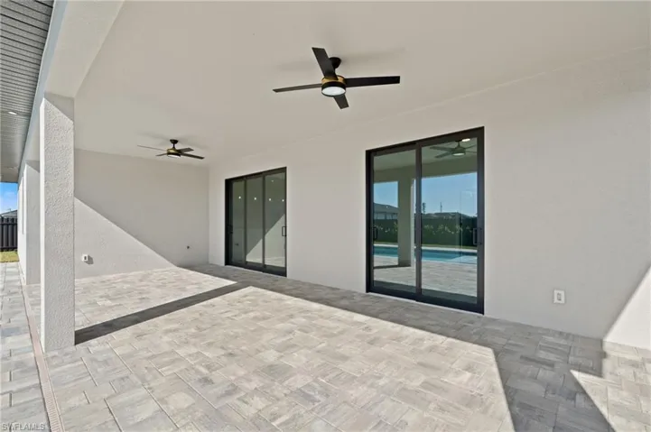 View of patio featuring ceiling fan