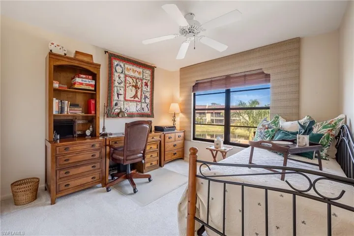 Bedroom with light colored carpet and ceiling fan