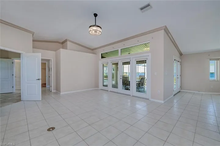 Tile flooring and electrical outlet in floor for motion furniture