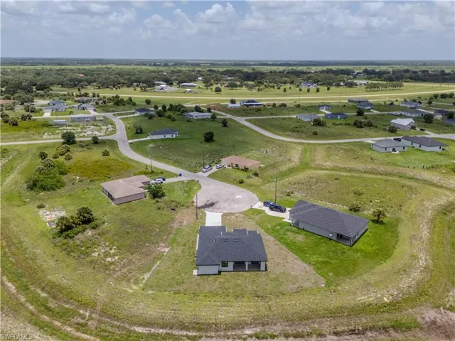 Aerial view of property and surrounding area with rural landscape