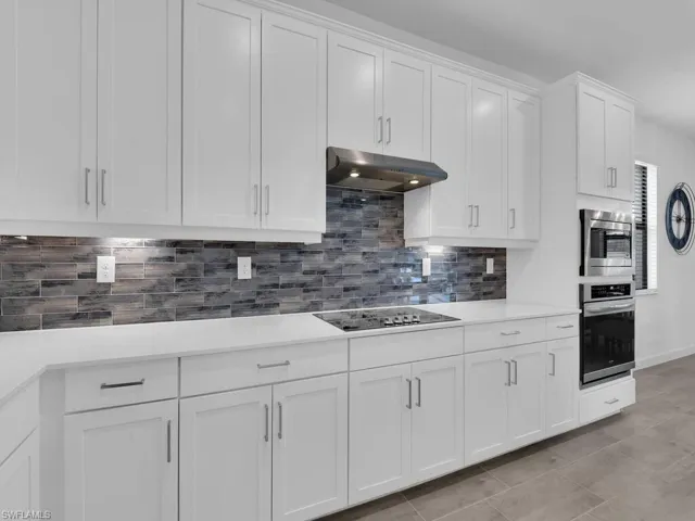 Designer Cabinetry & Custom Tile Backsplash