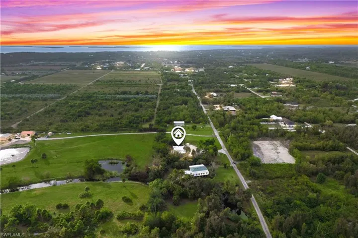 Sunset skies highlight the privacy and beauty of this secluded Pine Island property.