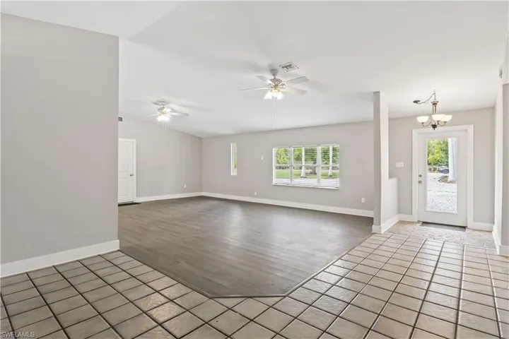 Spacious family and dining area designed for gatherings, offering an open-concept layout with beautiful views of the surrounding greenery.