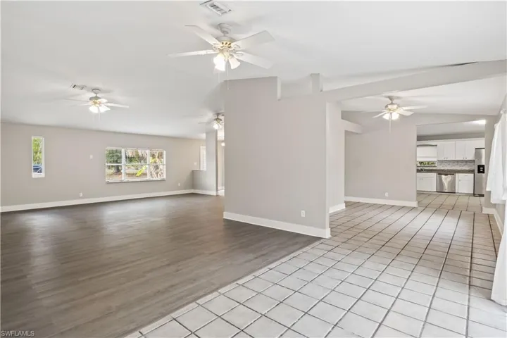 Soaring cathedral ceilings and open sightlines create a bright, expansive living space.