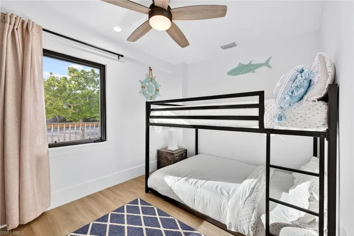 Bedroom featuring light wood-type flooring, recessed lighting, and ceiling fan
