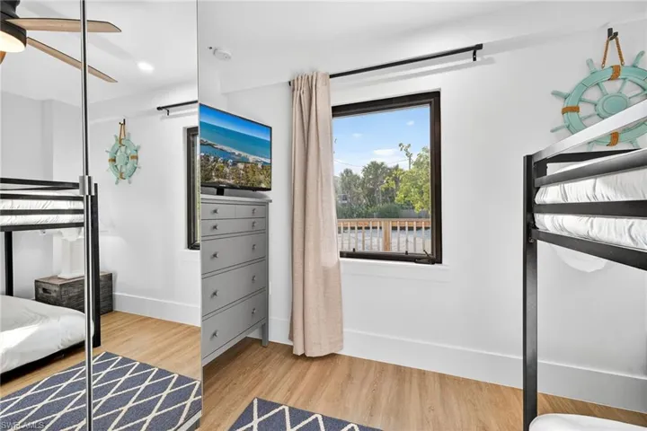 Bedroom featuring light wood-style floors and a ceiling fan