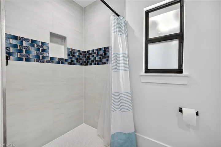 Bathroom featuring a shower stall