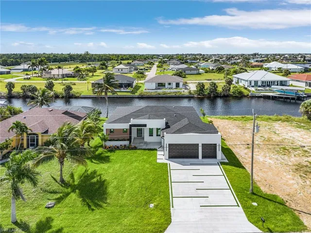 Aerial perspective of suburban area with a large body of water
