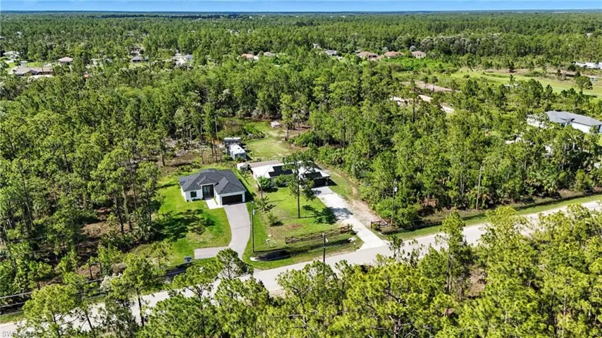 View of property location featuring a heavily wooded area