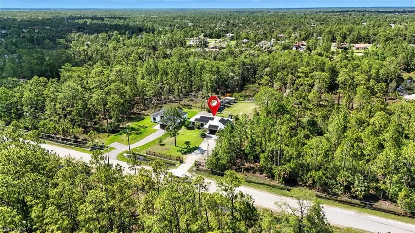 View of property location featuring a heavily wooded area