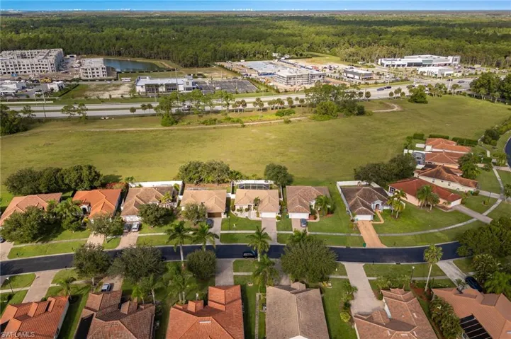 Aerial view of residential area featuring a heavily wooded area