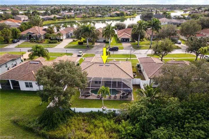 Aerial perspective of suburban area with a nearby body of water