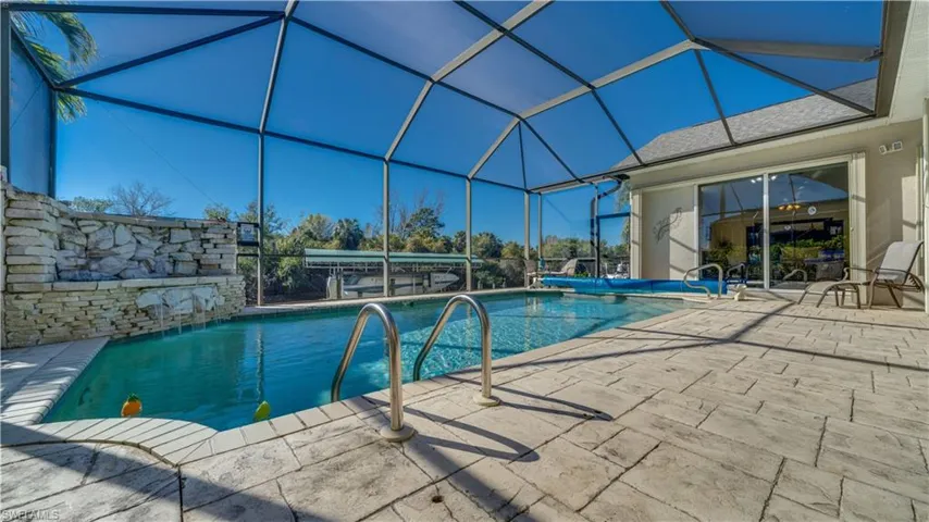 Swimming pool featuring a lanai
