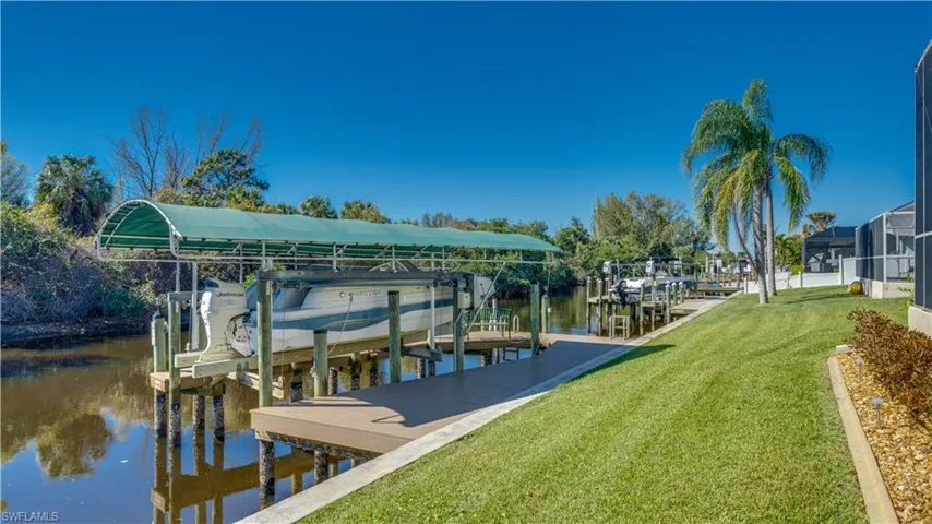 Backyard showing boat lift and canal