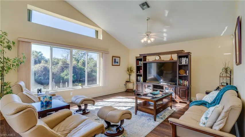 Family room with large windows overlooking the canal and preserve