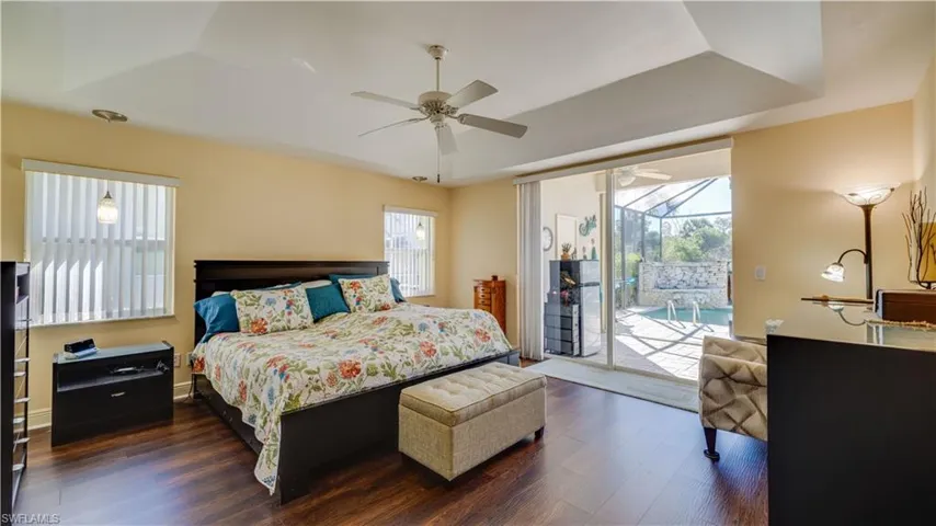Primary bedroom with sliders opening onto the lanai