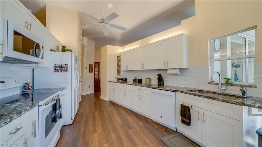 Large kitchen with granite tops