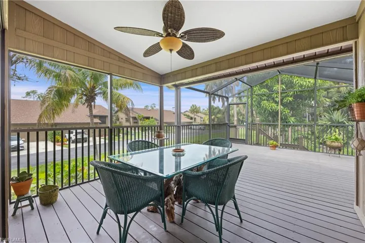 Sunroom featuring vaulted ceiling and ceiling fan