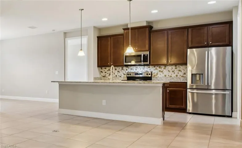 Kitchen w/ Stainless Appliances & Granite Counters