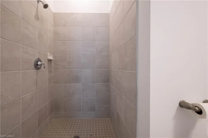 Bathroom featuring tiled shower