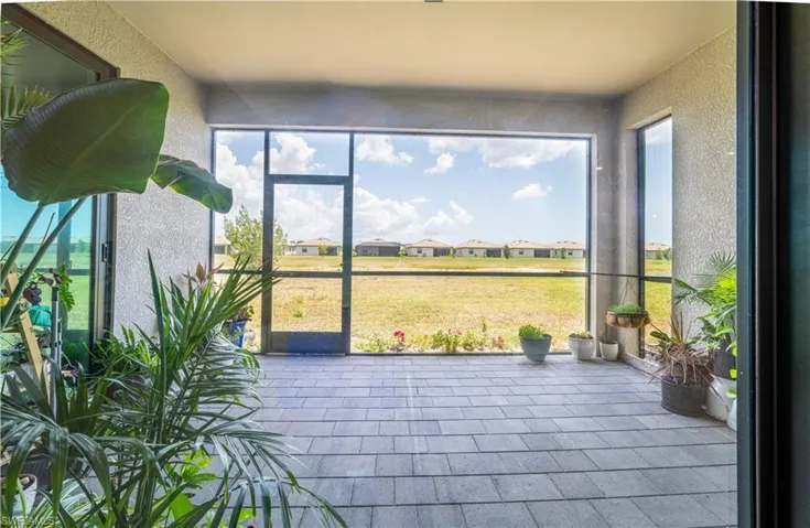 Unfurnished sunroom with a residential view