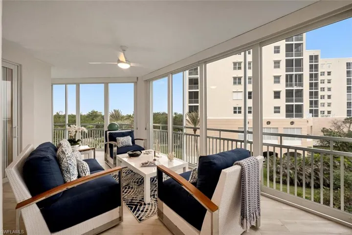 Sunroom featuring ceiling fan