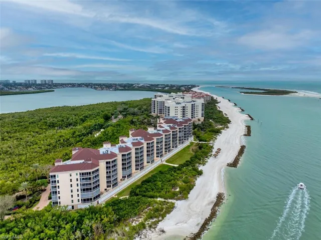 Aerial view with a water view and a view of the beach