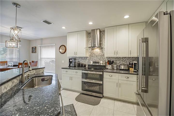 Updated kitchen with beautiful granite counters, newer high end appliances including double oven and Bosch Fridge and dishwasher
