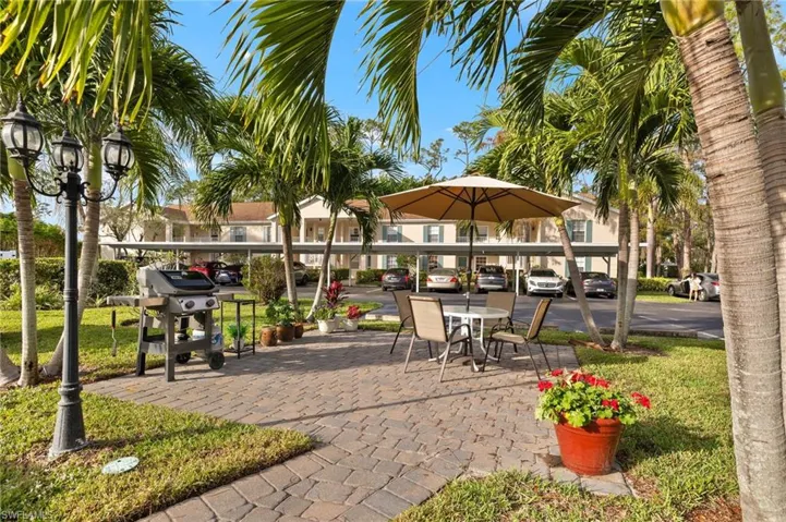 View of home's community BBQ and patio