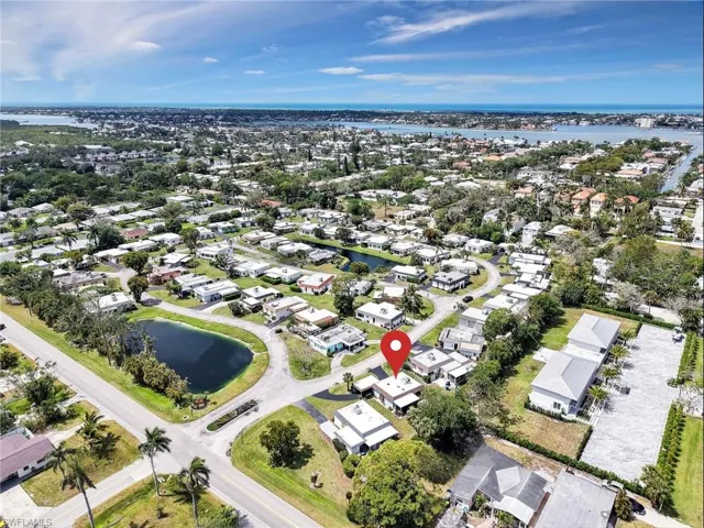 Drone / aerial view featuring a residential view and a water view