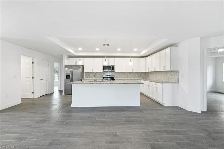 The Island Kitchen Comes With Stainless Steel Appliances, Granite Countertops, Tile Backsplash, White Shaker Wood Soft Touch Cabinets And Drawers, And A Large Walk-In Pantry!!