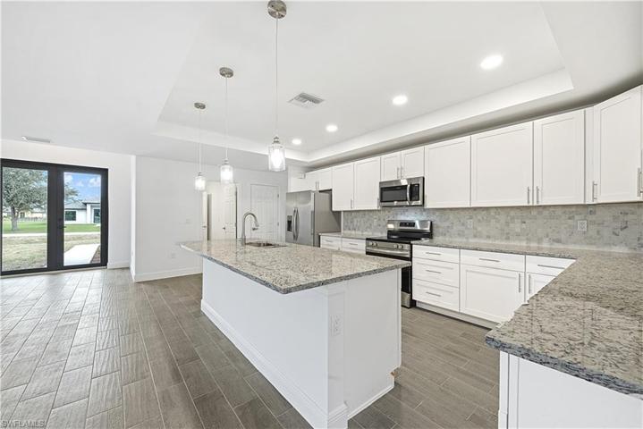 The Island Kitchen Comes With Stainless Steel Appliances, Granite Countertops, Tile Backsplash, White Shaker Wood Soft Touch Cabinets And Drawers, And A Large Walk-In Pantry!!