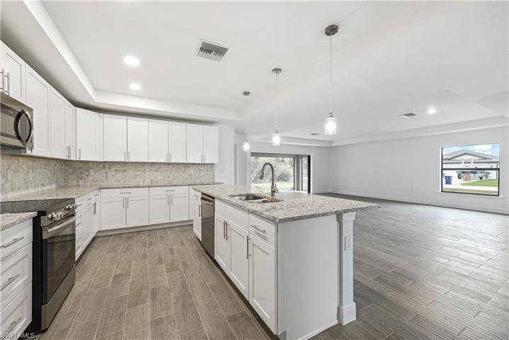 The Island Kitchen Comes With Stainless Steel Appliances, Granite Countertops, Tile Backsplash, White Shaker Wood Soft Touch Cabinets And Drawers, And A Large Walk-In Pantry!!