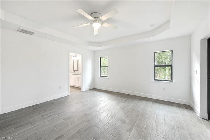 The Spacious Master Bedroom Has Trey Ceilings With A Light/Fan And A Private Entry Door Onto The Screened And Covered Lanai!