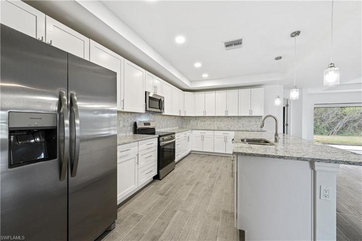 The Island Kitchen Comes With Stainless Steel Appliances, Granite Countertops, Tile Backsplash, White Shaker Wood Soft Touch Cabinets And Drawers, And A Large Walk-In Pantry!!