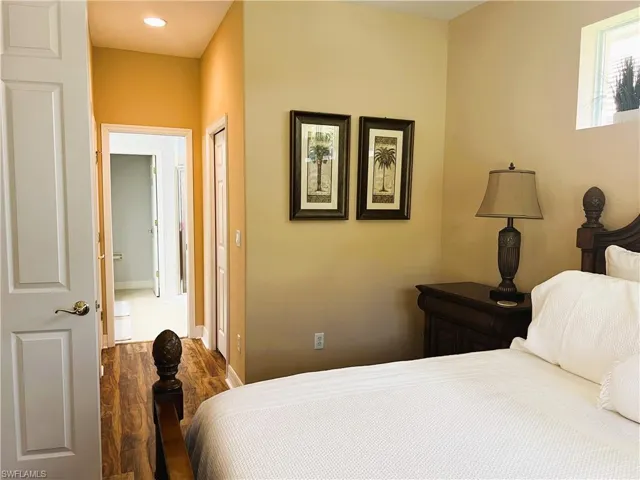 Bedroom with dark wood-type flooring