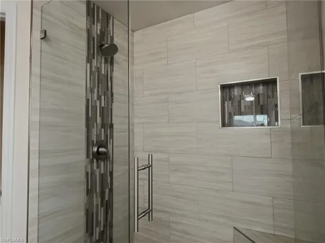 Bathroom featuring a shower stall