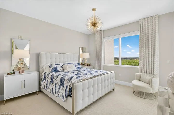 Bedroom with carpet flooring and baseboards