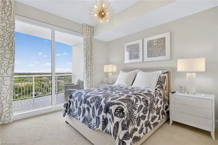 Bedroom featuring carpet flooring and access to exterior