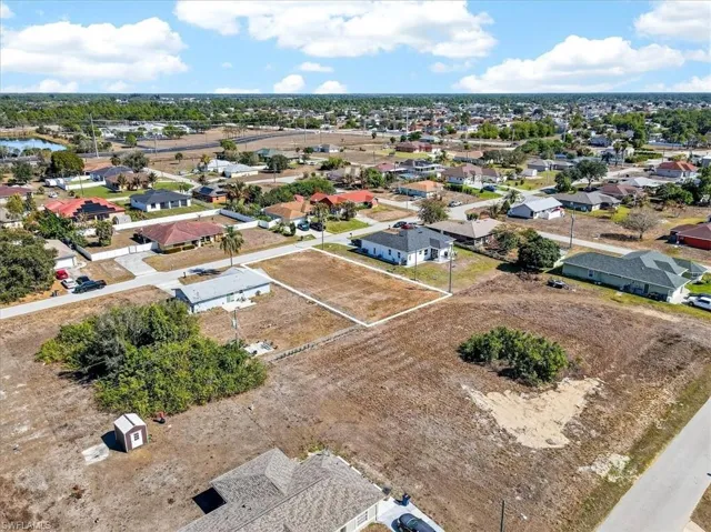 Aerial overview of property's location featuring nearby suburban area