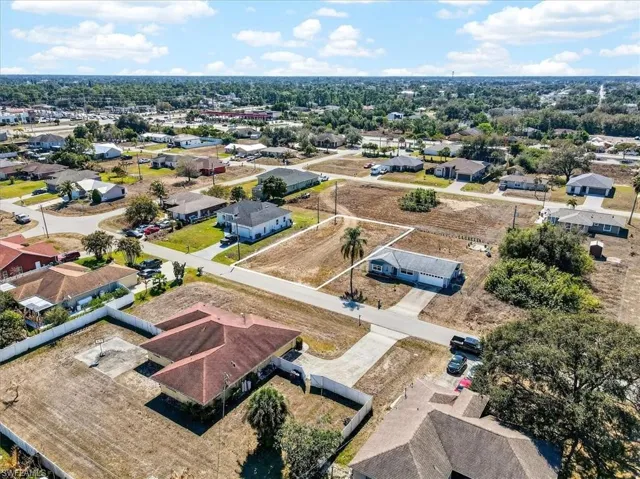 Aerial view of property's location with nearby suburban area