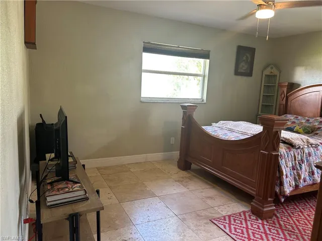 Large primary bedroom has walk in closet and bathroom.