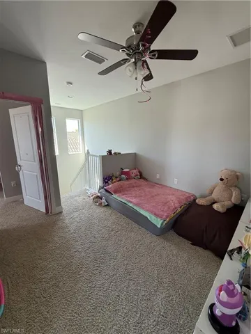 Bedroom with carpet floors and ceiling fan